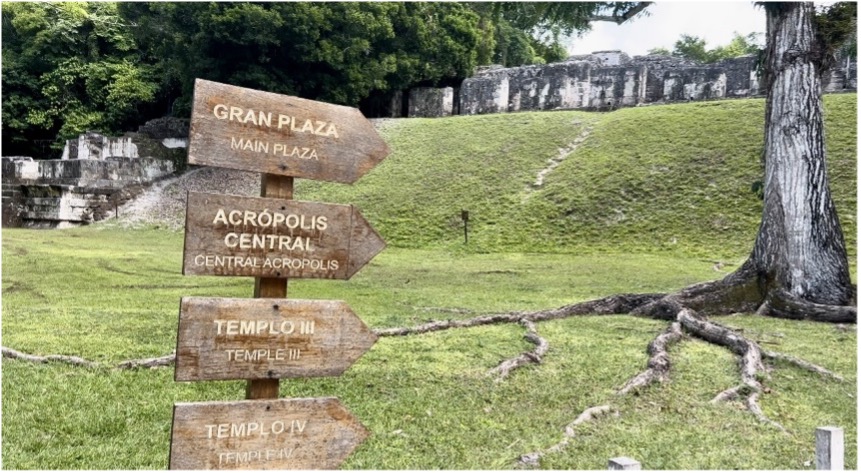 Wooden Signs point visitors to the Acropolis at Tikal Park in the Mayan biosphere region of Guatemala.